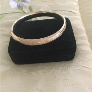 Woman’s 14KG laser designed bangle bracelet